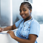 medium-shot-smiley-woman-taking-notes